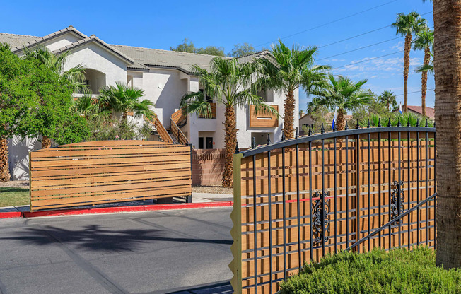 a gated community with palm trees