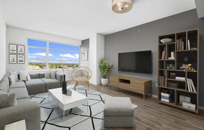 an apartment living room with a couch and a tv