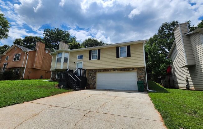 Spacious 4BR Split-Level Home with Fireplace & 2-Car Garage