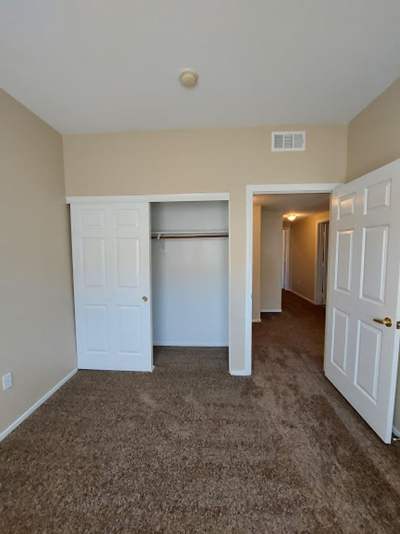 Three bedroom unit on the 2nd floor of gated SE community with pool/spa