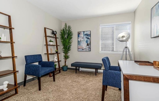 Living Room with two chairs and a table at Renew Madison, Wisconsin, 53711