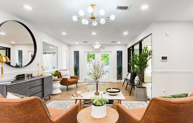 a living room with furniture and a large mirror