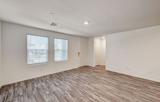 Adorable BRAND NEW three bedroom townhome with a 2 car garage in Tule Springs!