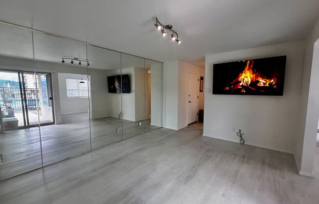 Updated 2-Bedroom Condo with Water Views, 2 Parking Spaces & Poolside Location