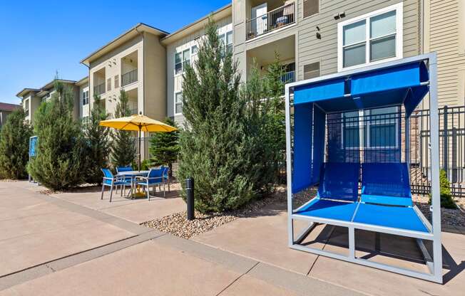 our apartments have a patio with a tennis court and tables