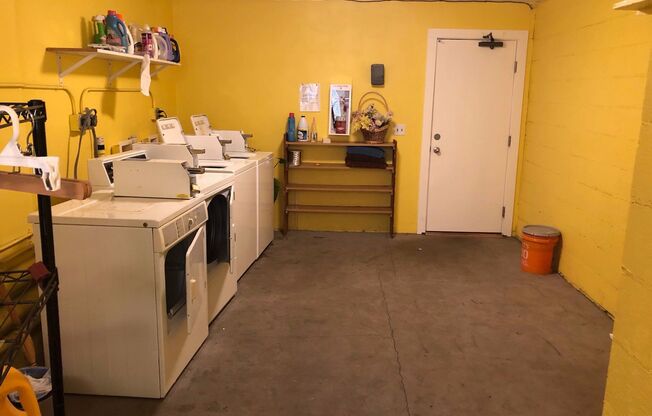 Corner 1bed, off street parking! Onsite coin-op laundry and onsite dog wash! All dogs welcome!