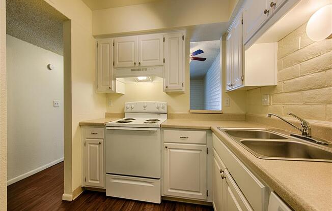 Spacious Kitchen with Pantry Cabinet at Fountain Plaza Apartments, Tucson, AZ
