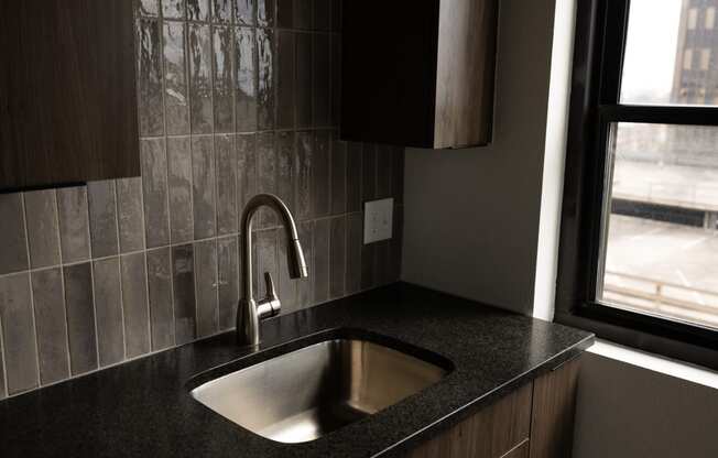 a kitchen with a sink and a window  at The Lady, South Carolina