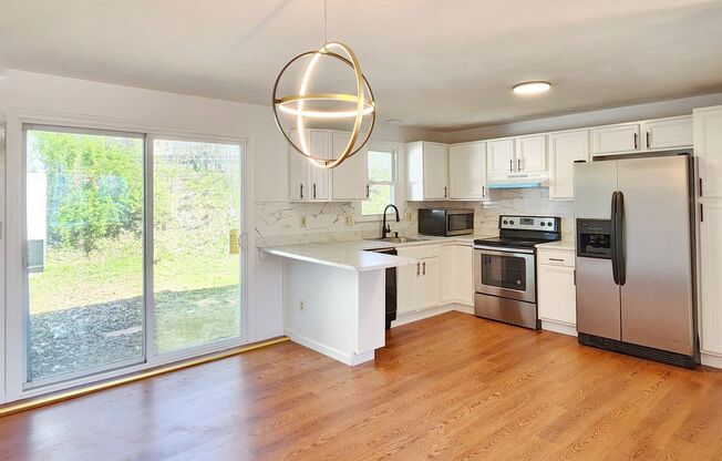 Beautifully remodeled townhouse with garage.