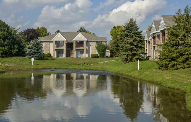 the view of a pond in front of a building