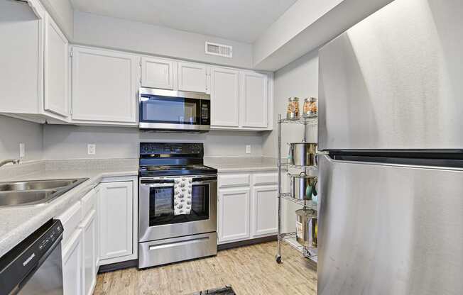 fully eqquiped kitchen with stainless steel appliances at fairway hills apartments