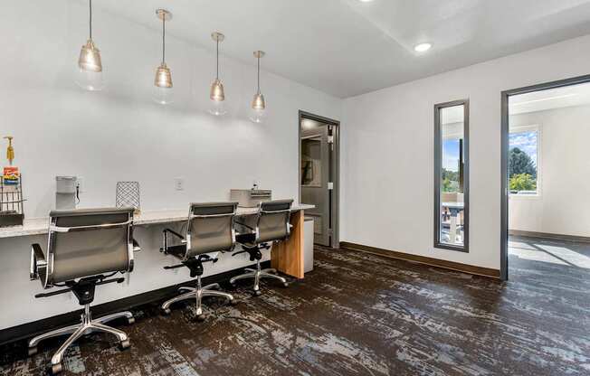 a conference room with a long desk and chairs and a window