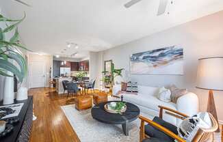 a living room and dining room with a couch and a table