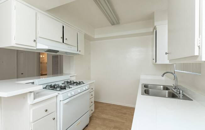 Kitchen with White Appliances and White Cabinets