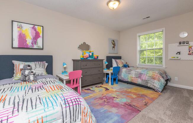 a living room filled with furniture and a bed in a bedroom