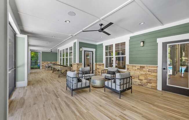 Langley Pointe Apartments | Screened in Patio w/ Seating Area