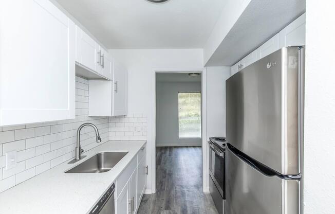 a stainless steel refrigerator in a kitchen