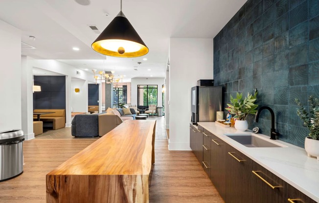 a kitchen with a wooden counter top and a sink