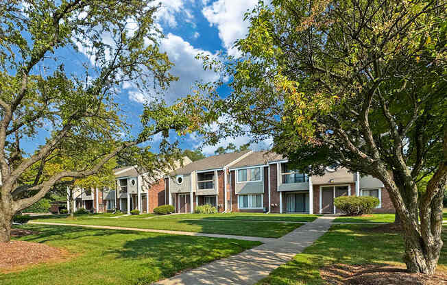 Private-Entry apartment buildings in Southfield with a walkway and sidewalk.