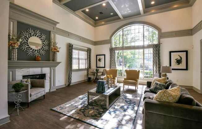 A living room with a fireplace and a large mirror on the wall.