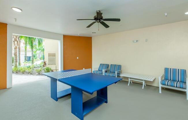 a room filled with furniture and a blue chair