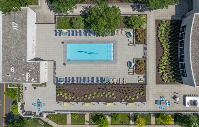 a birds eye view of a pool in the middle of a park