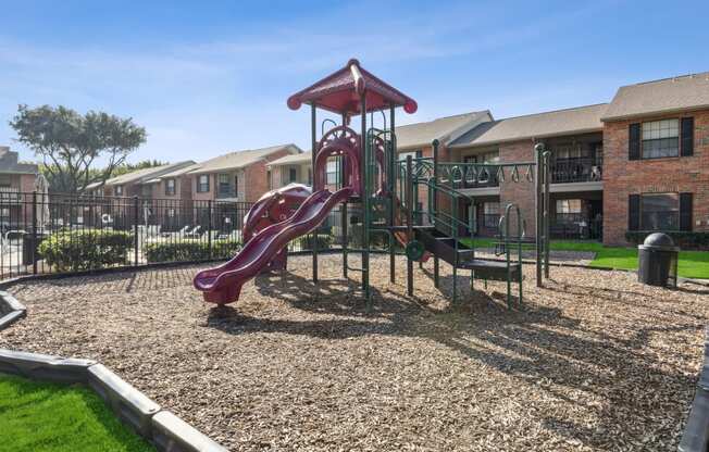 our apartments have a playground with a slide and picnic table