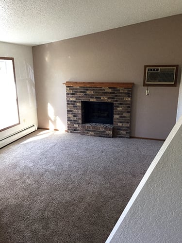 Living Area With Fireplace at Wellington Townhomes, Grand Forks, ND