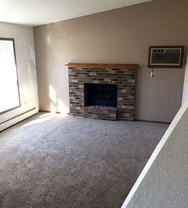 Living Area With Fireplace at Wellington Townhomes, Grand Forks, ND