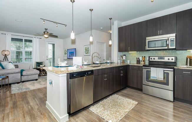 a large kitchen with stainless steel appliances