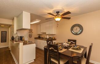 a kitchen with a table in a room