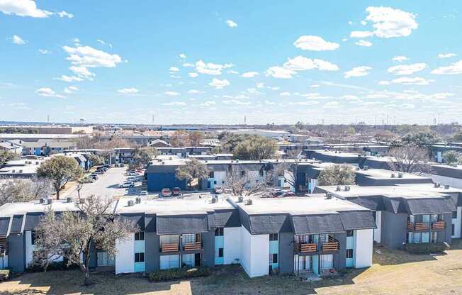an aerial view of a group of houses in a city