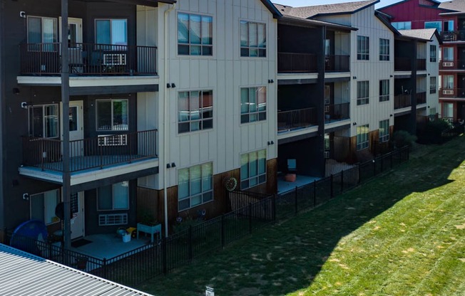 an exterior view of a building with fenced yards at Brooklyn West, Missoula, MT, 59808