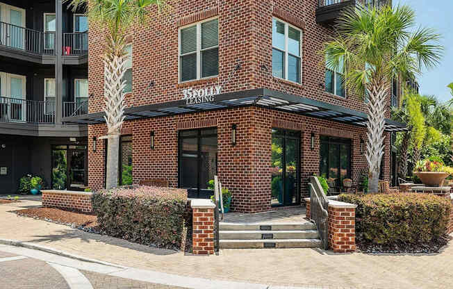 A brick building with a black awning and a sign that says