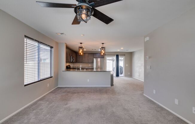 3-bedroom home featuring granite countertops, stainless steel appliances, and a covered backyard patio!