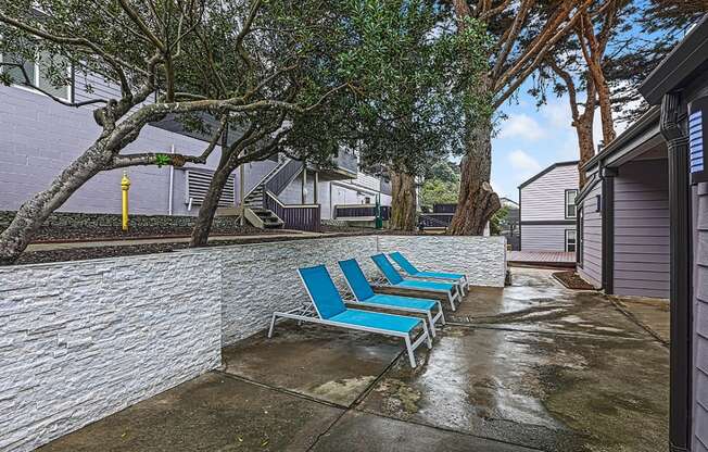 exterior shot with lounge chairs  at OceanAire Apartment Homes, Pacifica, CA, 94044