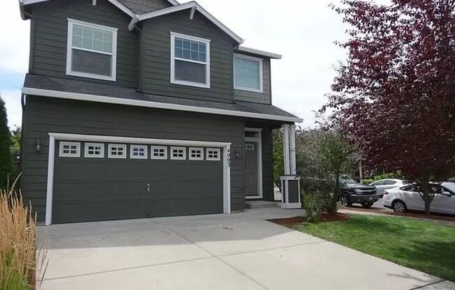 Spacious 4 bedroom home with covered deck and patio!