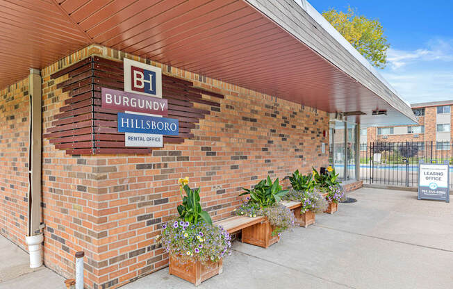 A building with a sign that says Burgundy Hillsboro Rental Office.