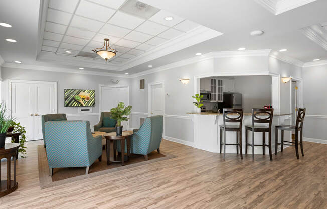 a living room with a dining area and a kitchen