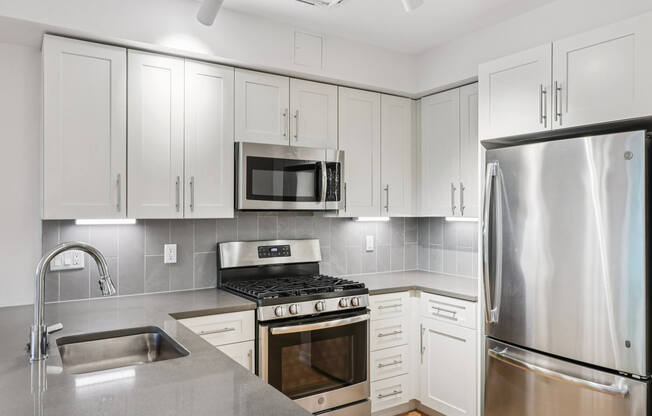 Modern kitchen with refrigerator at Park77 Apartments, Cambridge, Massachusetts