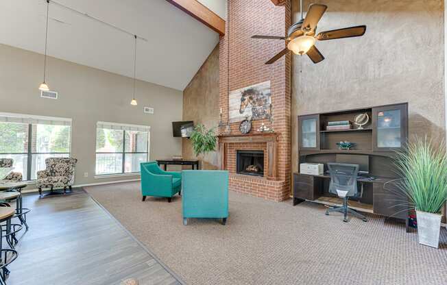 A room with a fireplace and a ceiling fan.