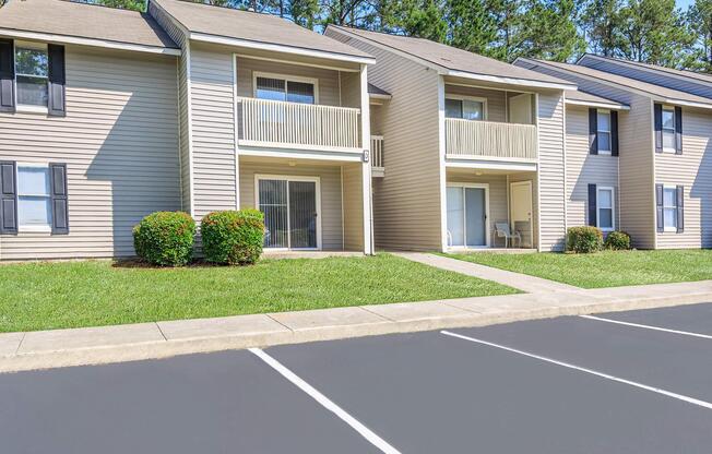 an empty parking lot in front of a house