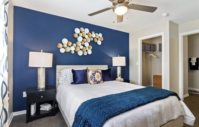 Model bedroom with blue accent wall