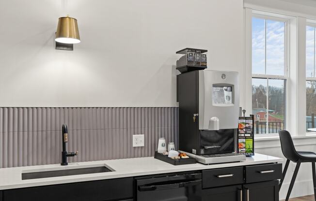 Kitchen with a sink and a coffee maker on the counter at Hadley Place Apartments, Pennsylvania