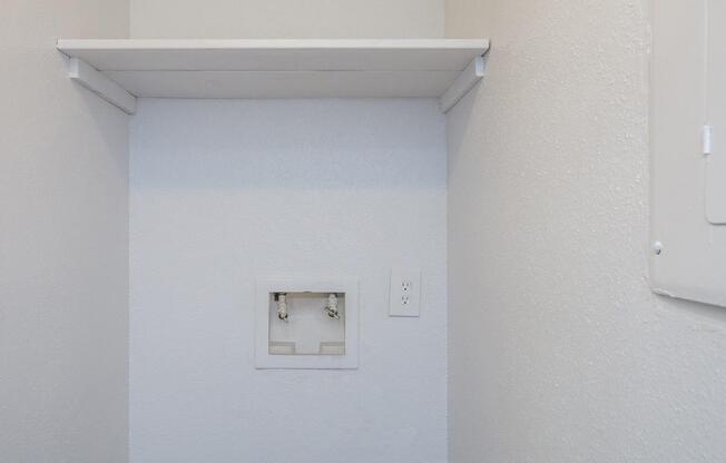 a white refrigerator freezer sitting next to a door