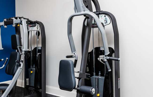 a gym with treadmills and other exercise equipment in a room