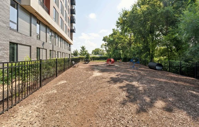 A red object is in the middle of a dirt area.