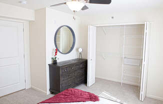 A bedroom with a walk-in closet at The Reserve at Destination Pointe, Grimes