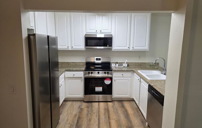 Special!! Newly renovated with new appliances 3 bedroom upstairs condo in gated community available now