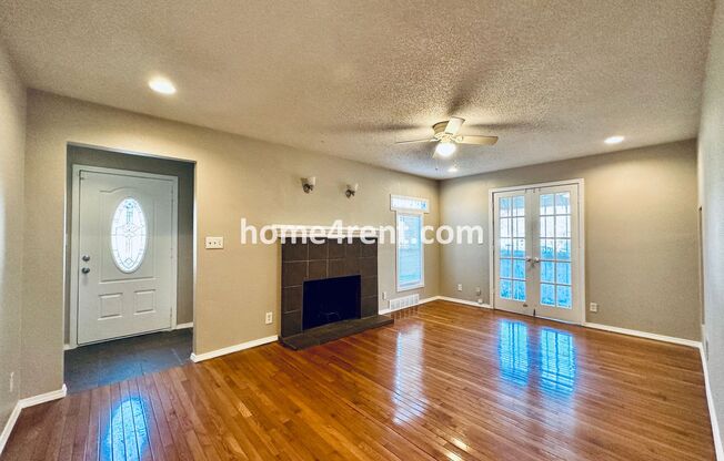Adorable Home Featuring Wood Floors, SS Appliances, Updated Bathrooms and Plenty of Natural Light!